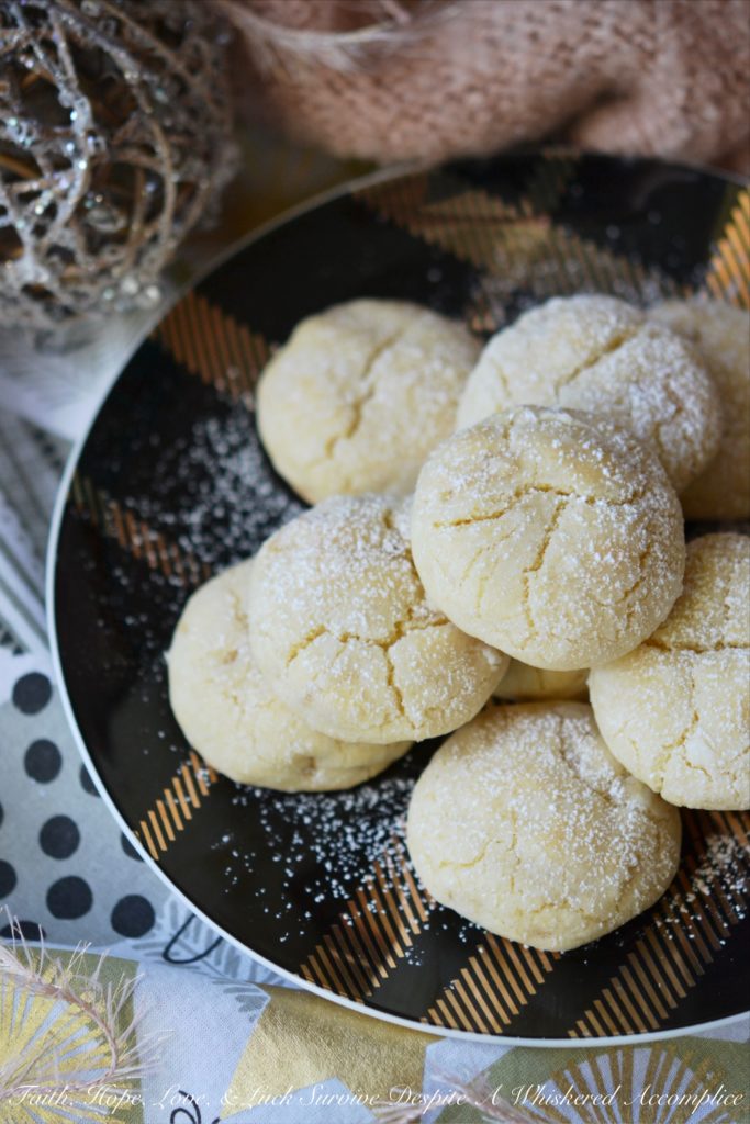 Lemon Ginger Crinkle Cookies - Lemon and ginger add a unique twist to these traditional crinkle cookies, making each bite sweet, tart, and just a little bit spicy.