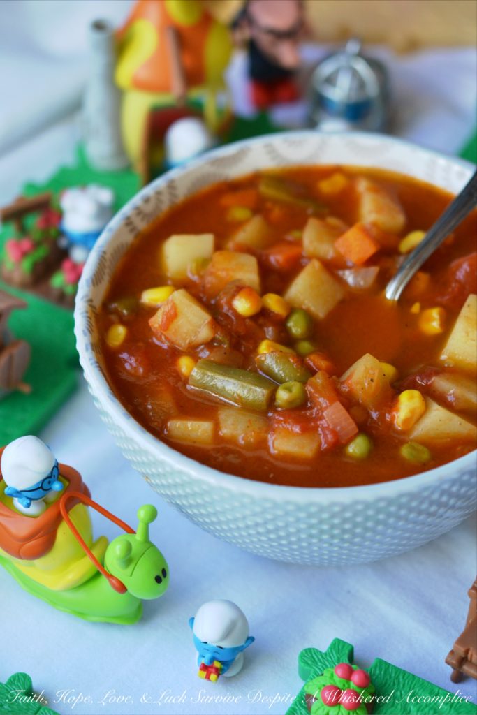 Classic Childhood Vegetable Soup - This classic childhood vegetable soup is loaded with potatoes, carrots, corn, green beans, peas, and onions. Its rich tomato base is prepared using tomato paste, low-sodium beef broth, and a can of crushed tomatoes. With the addition of a sweet yellow onion, a few red potatoes, and a bag of frozen mixed vegetables, this classic childhood favorite gets an extra boost of flavor and nutrition. Add in a couple of bay leaves, a sprinkle of salt and pepper, and you’ve got yourself a big ol’ pot of simple, soul-soothing homemade soup. It's comfort food at its best.
