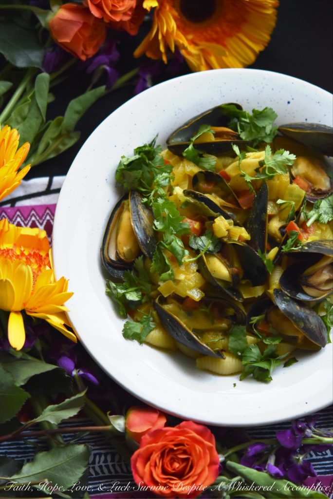 Coconut Curried Mussels - Mussels are a fantastic ingredient to cook with, as they can be easily transformed into either a delicious main dish or a flavorful seafood appetizer. In this mussel recipe, light coconut milk and curry seasoning blend together with diced sweet yellow onion and tomato, to make these fresh mussels both flavorful and unforgettable.