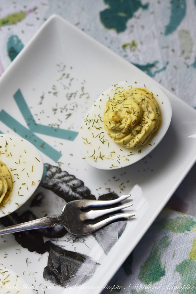 Dill Weed Deviled Eggs - Make ordinary deviled eggs "egg"traordinary with the addition of dill weed, pickle juice, mayonnaise, Dijon mustard, salt, pepper, and just a touch of sugar.