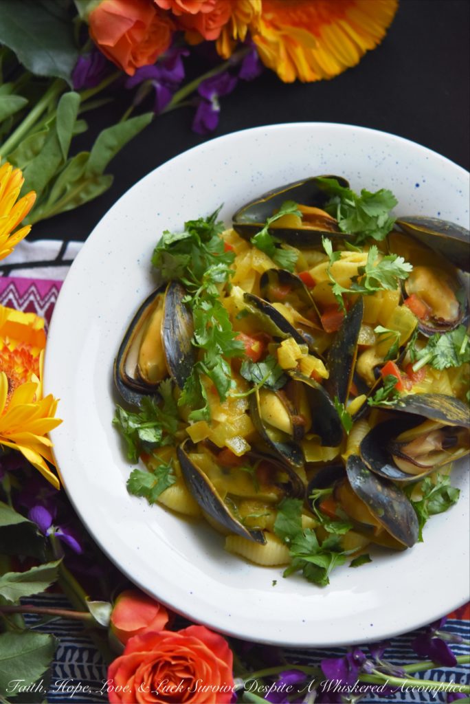Coconut Curried Mussels - Mussels are a fantastic ingredient to cook with, as they can be easily transformed into either a delicious main dish or a flavorful seafood appetizer. In this mussel recipe, light coconut milk and curry seasoning blend together with diced sweet yellow onion and tomato, to make these fresh mussels both flavorful and unforgettable.