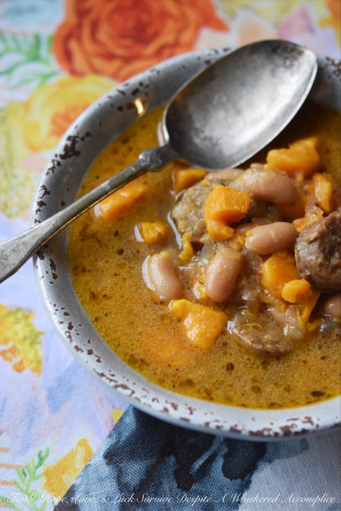 Cajun Bratwurst Slow-Cooker Soup - This bratwurst slow-cooker soup, containing cannellini beans and sweet potatoes, has just the right amount of Cajun kick with just a touch of sweetness. A can of light coconut milk also helps give this slow-cooked soup a hint of richness without making it too fattening.