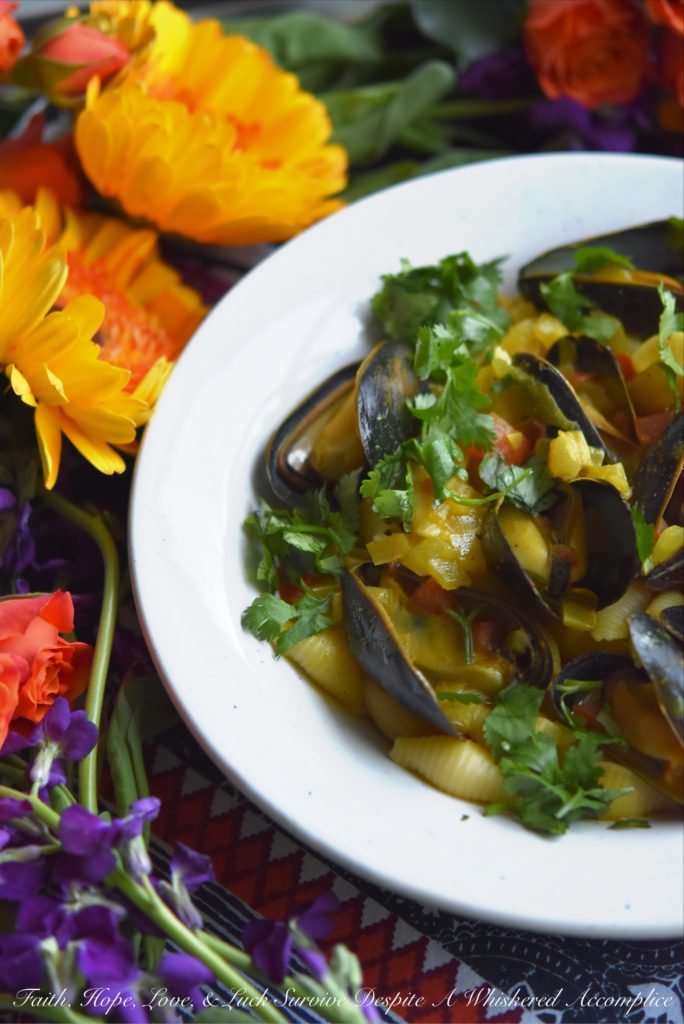 Coconut Curried Mussels - Mussels are a fantastic ingredient to cook with, as they can be easily transformed into either a delicious main dish or a flavorful seafood appetizer. In this mussel recipe, light coconut milk and curry seasoning blend together with diced sweet yellow onion and tomato, to make these fresh mussels both flavorful and unforgettable.