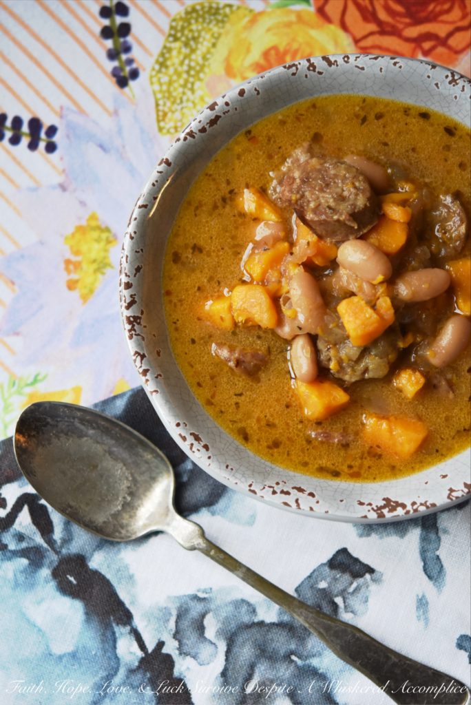 Cajun Bratwurst Slow-Cooker Soup - This bratwurst slow-cooker soup, containing cannellini beans and sweet potatoes, has just the right amount of Cajun kick with just a touch of sweetness. A can of light coconut milk also helps give this slow-cooked soup a hint of richness without making it too fattening.