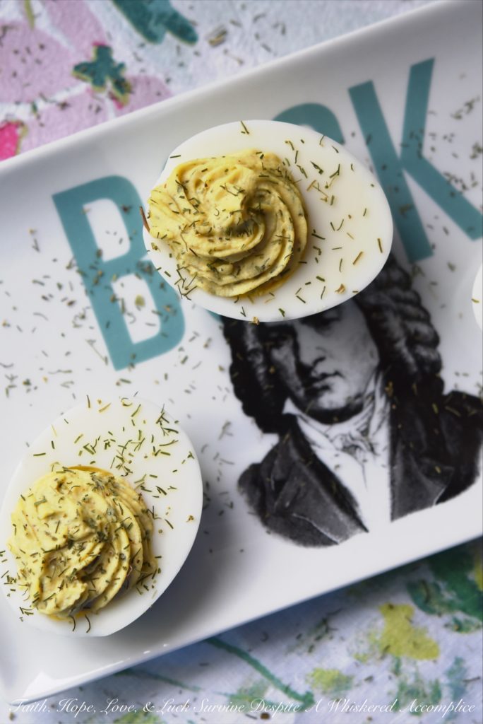 Dill Weed Deviled Eggs - Make ordinary deviled eggs "egg"traordinary with the addition of dill weed, pickle juice, mayonnaise, Dijon mustard, salt, pepper, and just a touch of sugar.