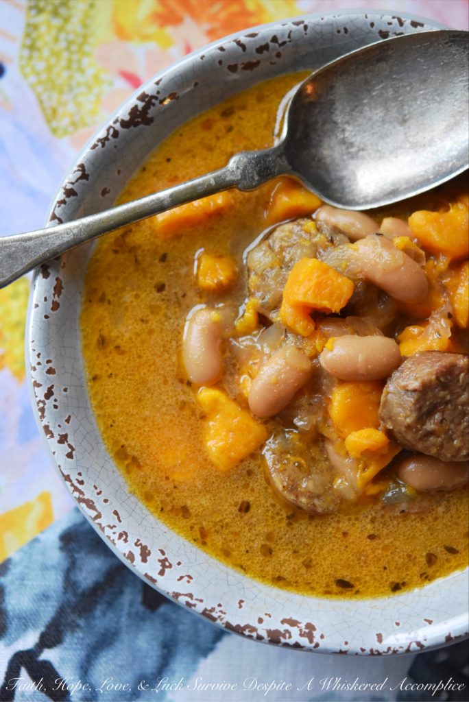 Cajun Bratwurst Slow-Cooker Soup - This bratwurst slow-cooker soup, containing cannellini beans and sweet potatoes, has just the right amount of Cajun kick with just a touch of sweetness. A can of light coconut milk also helps give this slow-cooked soup a hint of richness without making it too fattening.