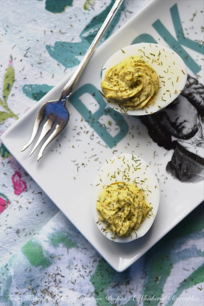 Dill Weed Deviled Eggs - Make ordinary deviled eggs "egg"traordinary with the addition of dill weed, pickle juice, mayonnaise, Dijon mustard, salt, pepper, and just a touch of sugar.