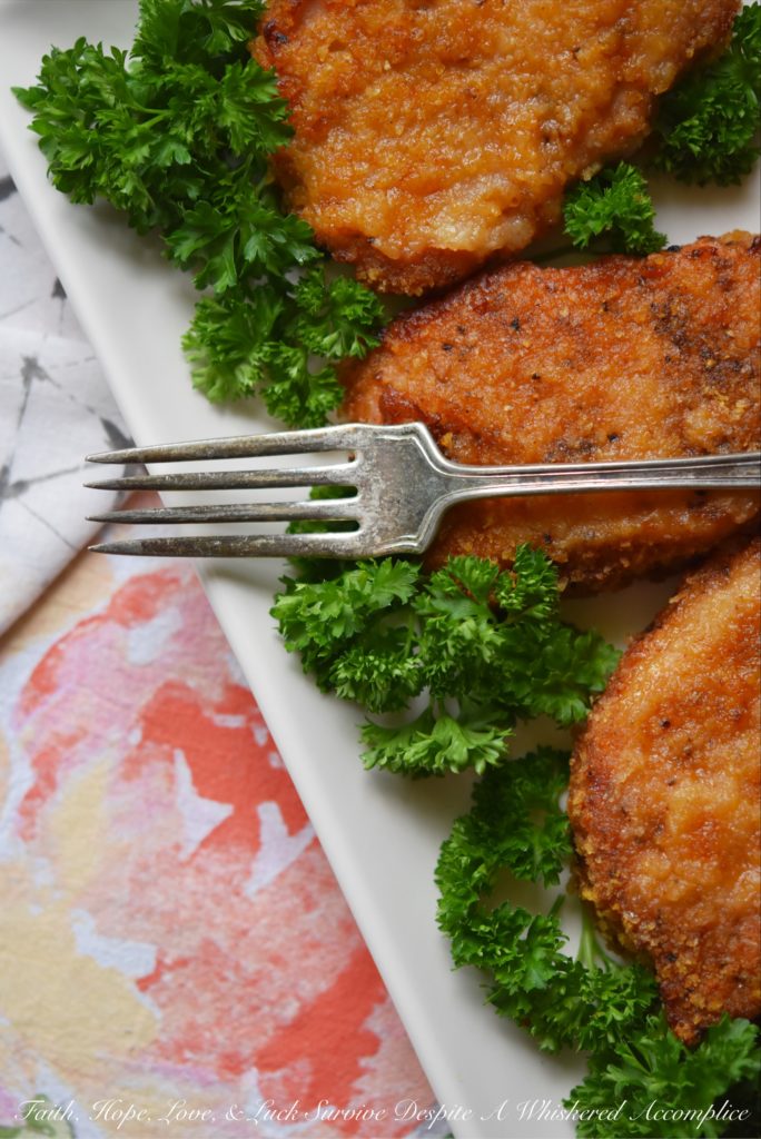 Baked BBQ Potato Chip Crusted Pork Chops - Flavorful baked pork chops are only a few simple ingredients away. Crushed BBQ potato chips, salt, pepper, paprika, and a little bit of olive oil are all you need to turn ordinary bland boneless pork chops into something unforgettable.