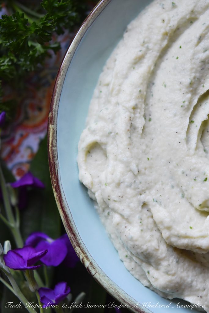 Creamy Mashed Cauliflower with Asiago & Parsley - Asiago and fresh parsley help turn this healthier mashed potato alternative into a flavorful side dish. Your family will fall in love with this creamy mashed cauliflower and you'll love just how quick and easy it is to make.