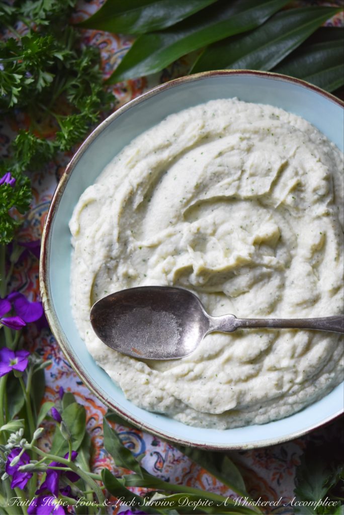 Creamy Mashed Cauliflower with Asiago & Parsley - Asiago and fresh parsley help turn this healthier mashed potato alternative into a flavorful side dish. Your family will fall in love with this creamy mashed cauliflower and you'll love just how quick and easy it is to make.