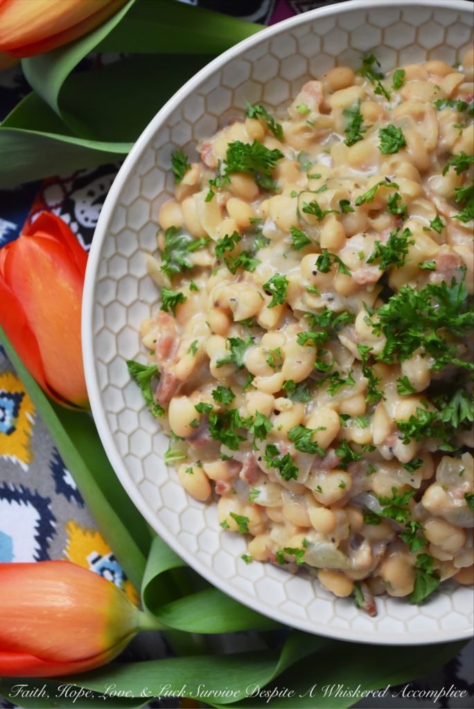 Creamy Southern Navy Beans with Bacon - While these creamy navy beans with bacon may take a little bit of time to make, either on a stovetop or with the help of a pressure cooker, they are more than worth the effort. I guarantee you're totally gonna fall in love with this flavorful southern side dish.