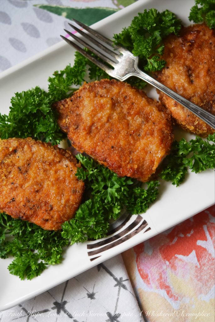 Baked BBQ Potato Chip Crusted Pork Chops - Flavorful baked pork chops are only a few simple ingredients away. Crushed BBQ potato chips, salt, pepper, paprika, and a little bit of olive oil are all you need to turn ordinary bland boneless pork chops into something unforgettable.