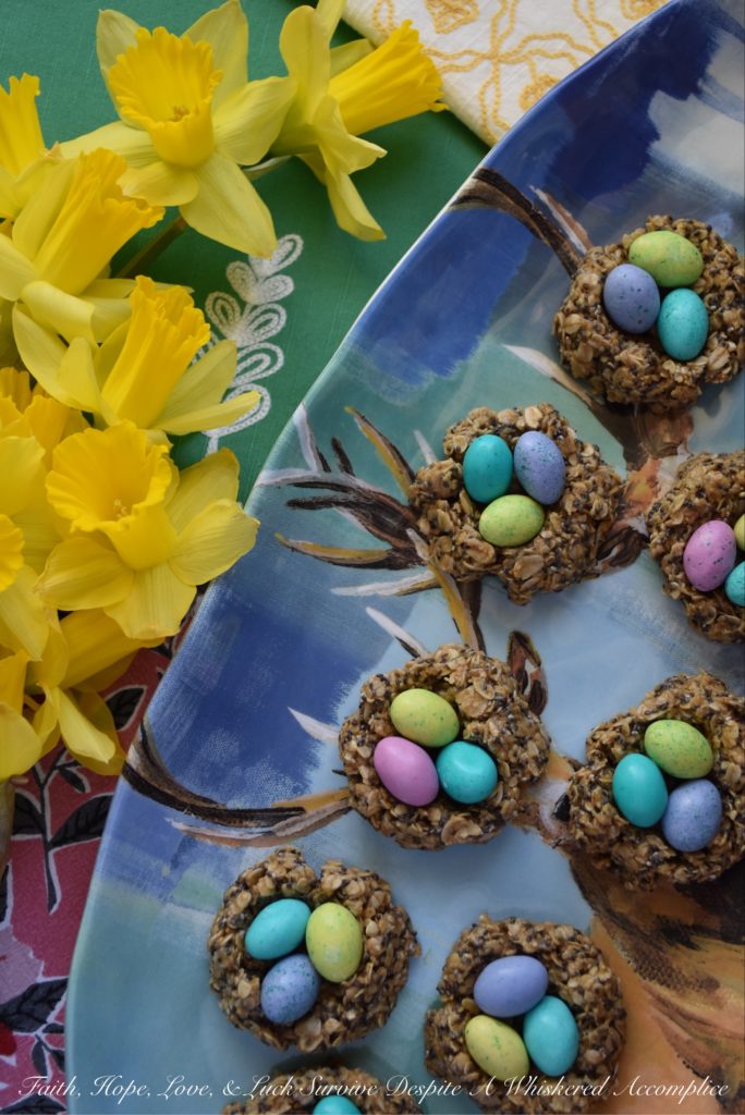 Crunchy Easter Bird Nest Granola Bites - These sweet peanut butter, oat, and chia seed bird nest granola bites are chewy and creamy with an added candy chocolate egg crunch to make them simply irresistible. This is definitely a dessert for breakfast treat you'll want to find in your Easter basket this spring.