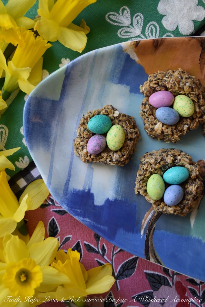 Crunchy Easter Bird Nest Granola Bites - These sweet peanut butter, oat, and chia seed bird nest granola bites are chewy and creamy with an added candy chocolate egg crunch to make them simply irresistible. This is definitely a dessert for breakfast treat you'll want to find in your Easter basket this spring.