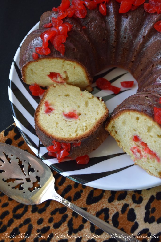 Vivid red maraschino cherries give this luscious lemon buttermilk Bundt cake a distinctive flavor, while also making it brilliantly, colorfully, and deliciously beautiful.
