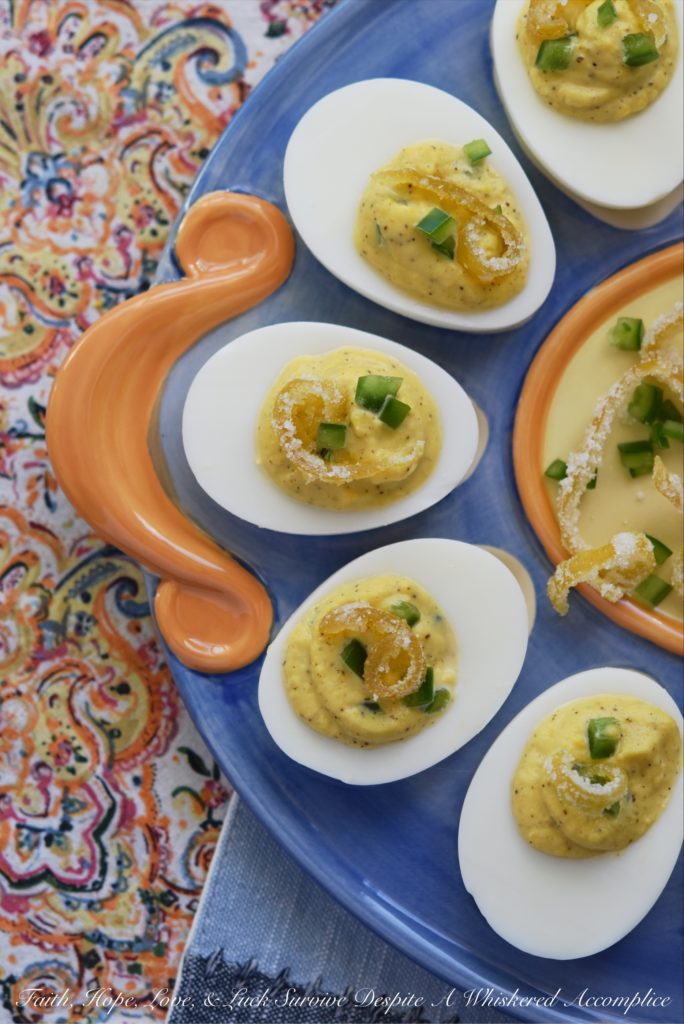 Candied Lemon Zest Jalapeño Deviled Eggs - Candied lemon zest and finely chopped jalapeños turn ordinary deviled eggs into something quite extraordinary, with the addition of a touch of mayonnaise, honey, and freshly squeezed lemon juice. Add a little bit of salt and pepper, and your taste buds will simply go crazy due to absolute flavor overload.