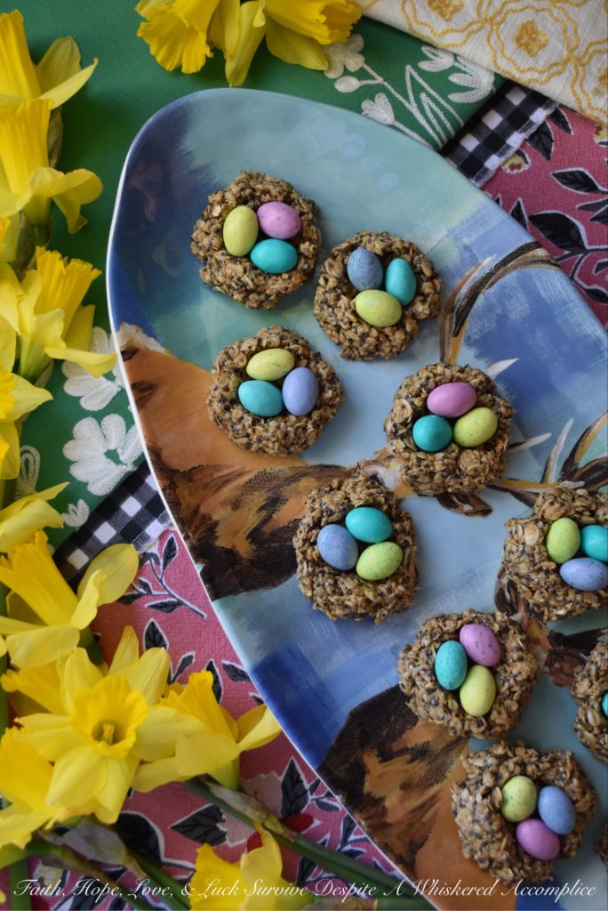 Crunchy Easter Bird Nest Granola Bites - These sweet peanut butter, oat, and chia seed bird nest granola bites are chewy and creamy with an added candy chocolate egg crunch to make them simply irresistible. This is definitely a dessert for breakfast treat you'll want to find in your Easter basket this spring.