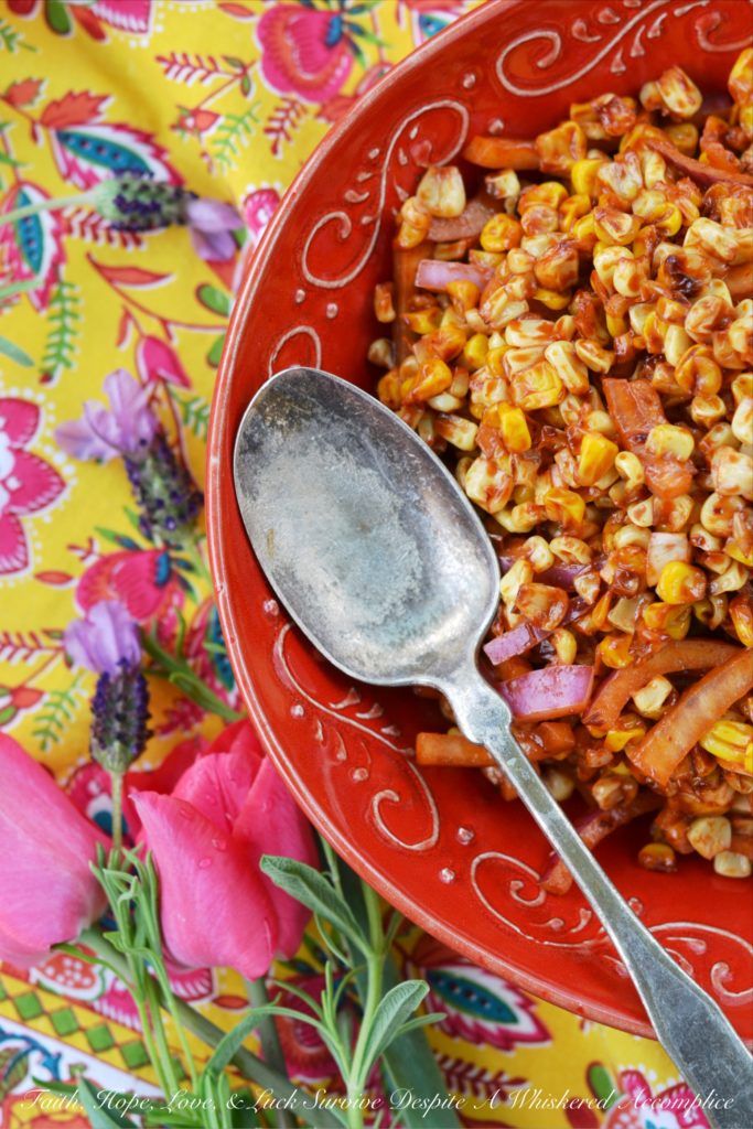 Roasted Corn Salad with Chile Vinaigrette - The perfect picnic or cookout side dish is one that is not only super flavorful but one that can hold its own against high summer temperatures. This incredible summer roasted corn salad has just the right amount of smokey chile flavor with just a touch of sweetness to help balance everything out and is also safe to serve on even the hottest summer day.