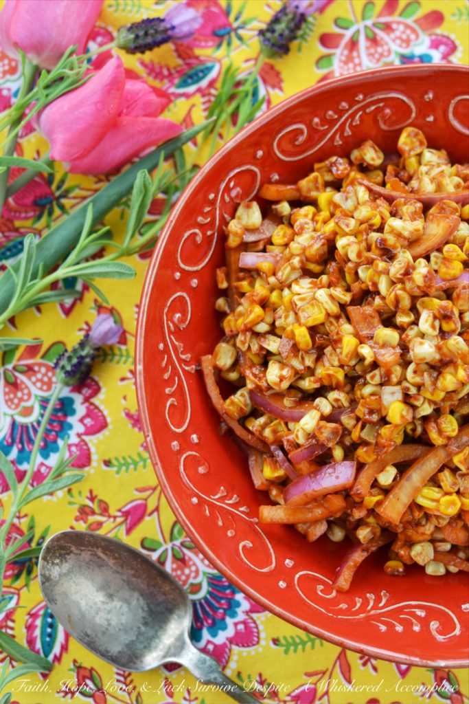 Roasted Corn Salad with Chile Vinaigrette - The perfect picnic or cookout side dish is one that is not only super flavorful but one that can hold its own against high summer temperatures. This incredible summer roasted corn salad has just the right amount of smokey chile flavor with just a touch of sweetness to help balance everything out and is also safe to serve on even the hottest summer day.