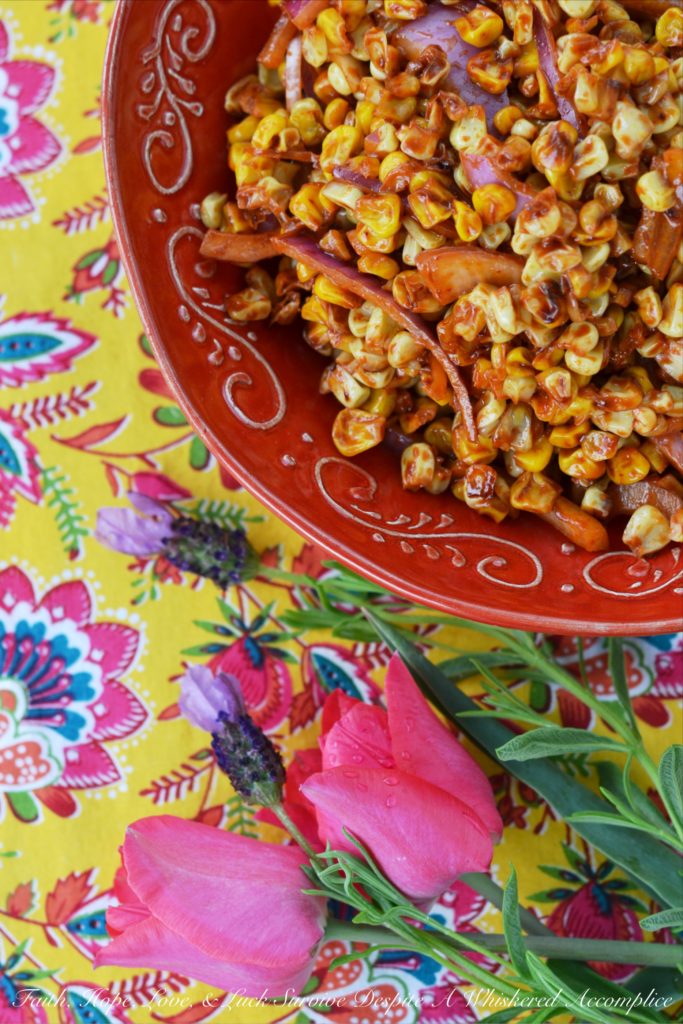 Roasted Corn Salad with Chile Vinaigrette - The perfect picnic or cookout side dish is one that is not only super flavorful but one that can hold its own against high summer temperatures. This incredible summer roasted corn salad has just the right amount of smokey chile flavor with just a touch of sweetness to help balance everything out and is also safe to serve on even the hottest summer day.