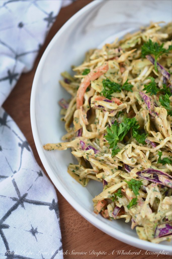 Spicy Chipotle Lime Coleslaw - Ground chipotle, fresh lime juice, and a touch of honey give this quick to toss together summer coleslaw a tart, sweet, and spicy flavor that your entire family is sure to enjoy at your next cookout, picnic, or BBQ.