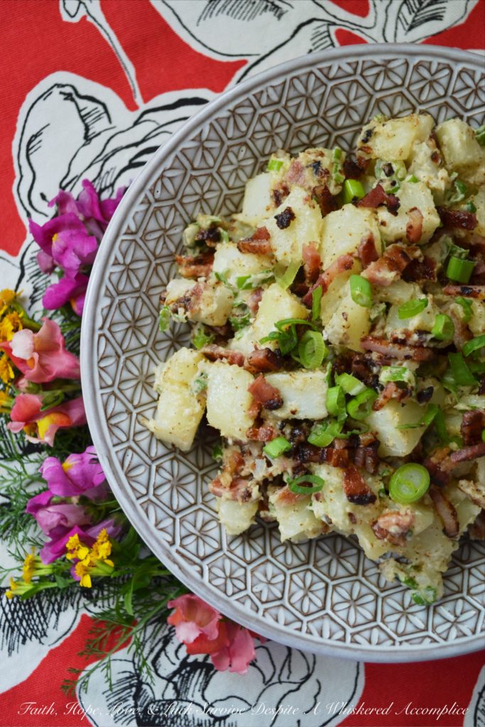 Summer BBQ Bacon Potato Salad - Say "Hello" to summertime with this simple yet super flavorful potato salad. There's a full pound of bacon folded into this summer side dish, which is first liberally brushed with barbecue sauce and then baked until browned and perfectly crispy. After you add a little bit of mayonnaise, black pepper, and finely chopped scallions, this potato salad will be ready to head to your next BBQ, picnic, or summer cookout.