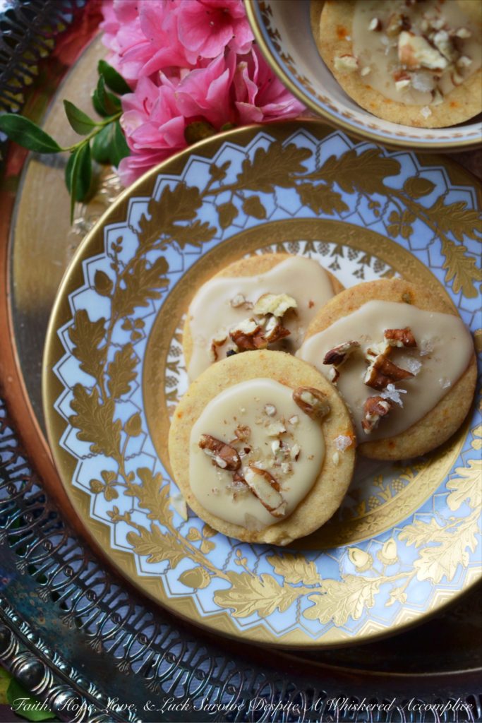 Kentucky Bourbon Pecan Chile Shortbread - A ground guajillo chile and a touch of Kentucky bourbon help to make these crumbly buttery shortbread cookies a tea-time treat you won't soon forget. And as if that weren't enough, a drizzle of vanilla bourbon glaze, a sprinkle of finely chopped pecans, and the littlest pinch of Fleur de Sel help to transform these flavorful shortbread cookies into something even more magical.