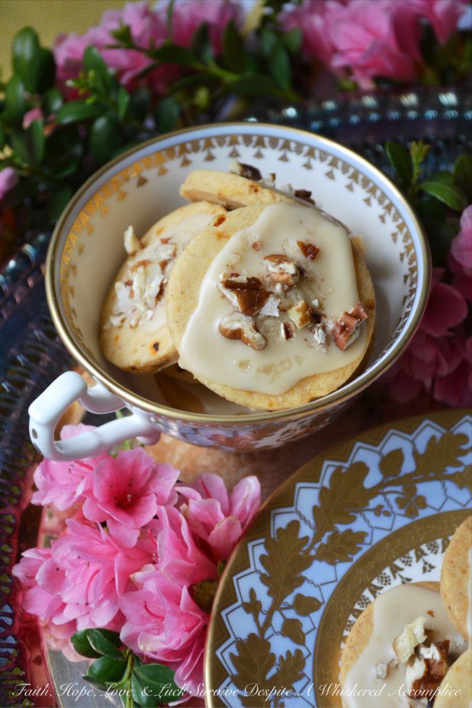 Kentucky Bourbon Pecan Chile Shortbread - A ground guajillo chile and a touch of Kentucky bourbon help to make these crumbly buttery shortbread cookies a tea-time treat you won't soon forget. And as if that weren't enough, a drizzle of vanilla bourbon glaze, a sprinkle of finely chopped pecans, and the littlest pinch of Fleur de Sel help to transform these flavorful shortbread cookies into something even more magical.