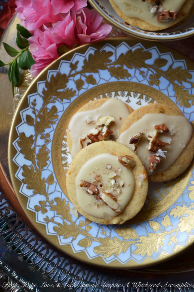 Kentucky Bourbon Pecan Chile Shortbread - A ground guajillo chile and a touch of Kentucky bourbon help to make these crumbly buttery shortbread cookies a tea-time treat you won't soon forget. And as if that weren't enough, a drizzle of vanilla bourbon glaze, a sprinkle of finely chopped pecans, and the littlest pinch of Fleur de Sel help to transform these flavorful shortbread cookies into something even more magical.