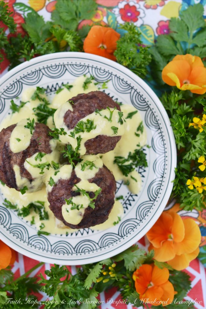 Grilled Stuffed Meatballs with Pineapple Sauce - It's always nice to have an alternative to the standard grilled hamburger during the summer months. These cheese-stuffed meatballs are seasoned with steak seasoning, grilled, and then served with a sweet pineapple sauce made out of fresh pineapple, mayonnaise, and dijon mustard.