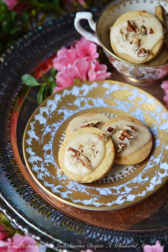 Kentucky Bourbon Pecan Chile Shortbread - A ground guajillo chile and a touch of Kentucky bourbon help to make these crumbly buttery shortbread cookies a tea-time treat you won't soon forget. And as if that weren't enough, a drizzle of vanilla bourbon glaze, a sprinkle of finely chopped pecans, and the littlest pinch of Fleur de Sel help to transform these flavorful shortbread cookies into something even more magical.