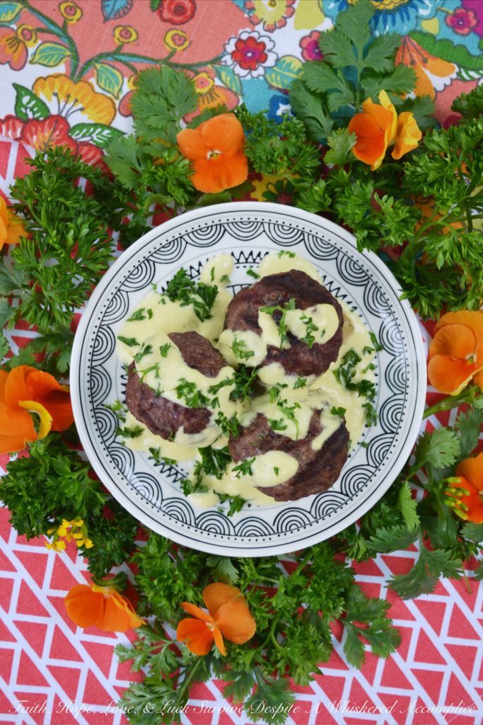 Grilled Stuffed Meatballs with Pineapple Sauce - It's always nice to have an alternative to the standard grilled hamburger during the summer months. These cheese-stuffed meatballs are seasoned with steak seasoning, grilled, and then served with a sweet pineapple sauce made out of fresh pineapple, mayonnaise, and dijon mustard.