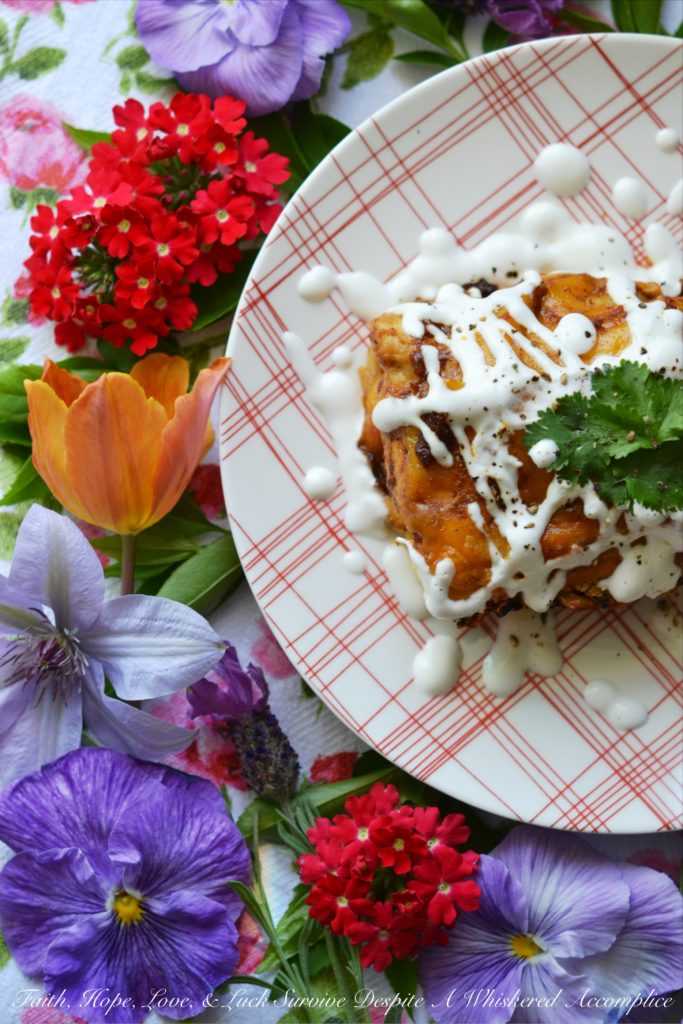 Ancho Chile Lime Pork Enchiladas | Dried ancho chile peppers and fresh lime juice make these flavorful pork enchiladas truly something special without burning off all of your taste buds. These cheddar cheese-covered enchiladas are sweet, tart, smoky, and packed with flavor. They're perfect for people who aren't crazy about spice but still want to enjoy some delicious Mexican food.