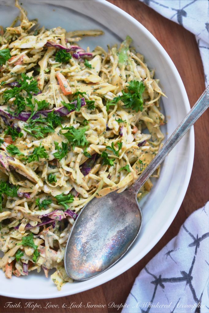 Spicy Chipotle Lime Coleslaw - Ground chipotle, fresh lime juice, and a touch of honey give this quick to toss together summer coleslaw a tart, sweet, and spicy flavor that your entire family is sure to enjoy at your next cookout, picnic, or BBQ.