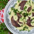 Grilled Stuffed Meatballs with Pineapple Sauce - It's always nice to have an alternative to the standard grilled hamburger during the summer months. These cheese-stuffed meatballs are seasoned with steak seasoning, grilled, and then served with a sweet pineapple sauce made out of fresh pineapple, mayonnaise, and dijon mustard.