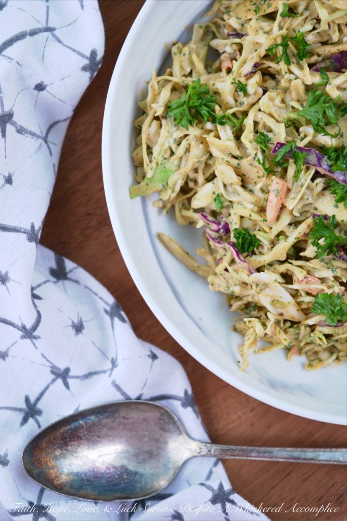 Spicy Chipotle Lime Coleslaw - Ground chipotle, fresh lime juice, and a touch of honey give this quick to toss together summer coleslaw a tart, sweet, and spicy flavor that your entire family is sure to enjoy at your next cookout, picnic, or BBQ.