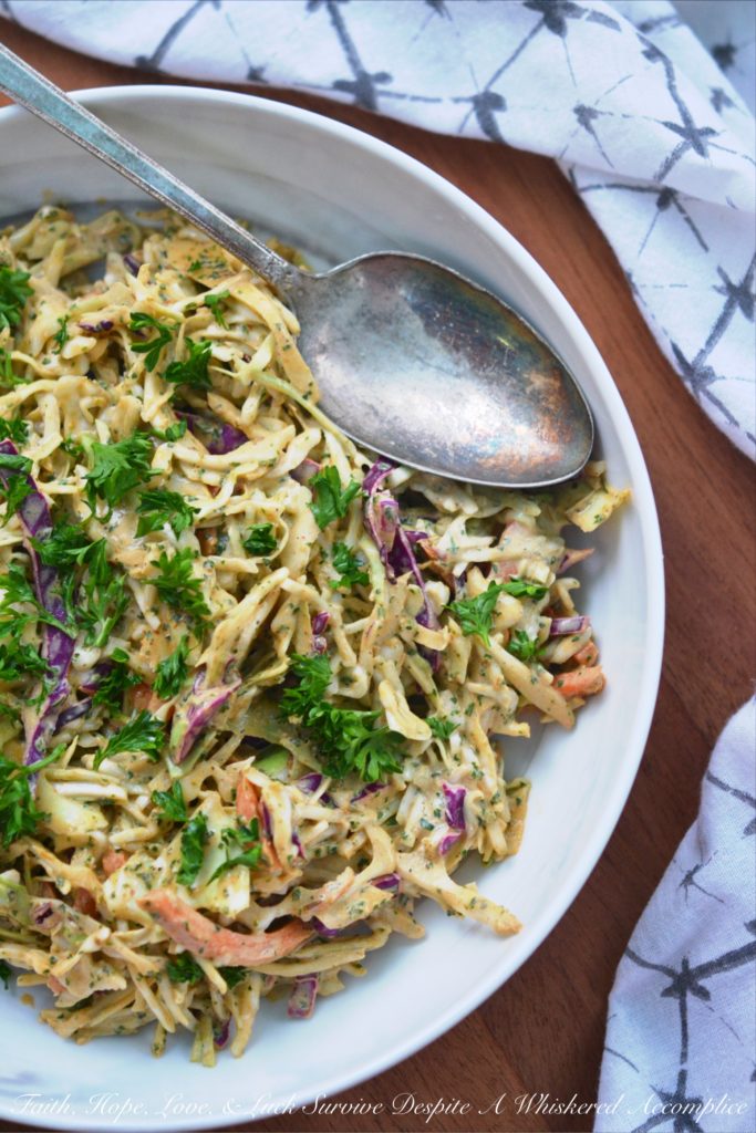 Spicy Chipotle Lime Coleslaw - Ground chipotle, fresh lime juice, and a touch of honey give this quick to toss together summer coleslaw a tart, sweet, and spicy flavor that your entire family is sure to enjoy at your next cookout, picnic, or BBQ.