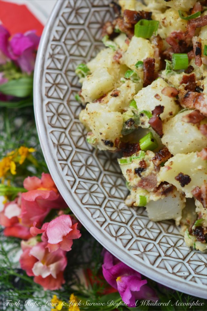 Summer BBQ Bacon Potato Salad - Say "Hello" to summertime with this simple yet super flavorful potato salad. There's a full pound of bacon folded into this summer side dish, which is first liberally brushed with barbecue sauce and then baked until browned and perfectly crispy. After you add a little bit of mayonnaise, black pepper, and finely chopped scallions, this potato salad will be ready to head to your next BBQ, picnic, or summer cookout.