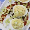 Celery & Whole Mustard Deviled Eggs - With five simple ingredients, you can kick up your deviled eggs this summer just in time to enjoy at your next cookout, picnic, or barbecue. These deviled eggs have a lovely crunch thanks to the finely diced celery both in the filling and used as a garnish, as well as tons of flavor from the whole Dijon mustard used to make the filling. These little guys are so simple to make but they are definitely anything but boring.