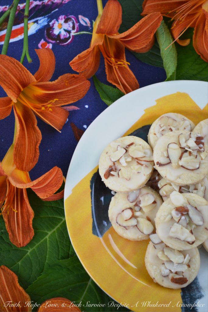 Almond & Orange Glazed Shortbread Cookies - A few teaspoons of orange extract in both the dough and glaze of these almond-topped buttery shortbread cookies helps to give these delicate glazed shortbread cookies a lovely orange flavor that is not too overwhelming or overly-sweet.