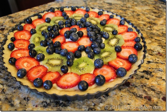 Easy Fruit Tart - Girl Gone Mom - The month of July is all about summer cookouts, picnics, and barbecues. We're sharing our favorite red, white, and blue patriotic themed recipes to help get you in the 4th of July spirit.