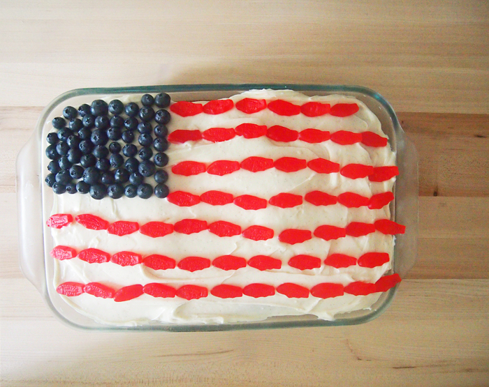 Flag Cake - Pies and Plots - The month of July is all about summer cookouts, picnics, and barbecues. We're sharing our favorite red, white, and blue patriotic themed recipes to help get you in the 4th of July spirit.