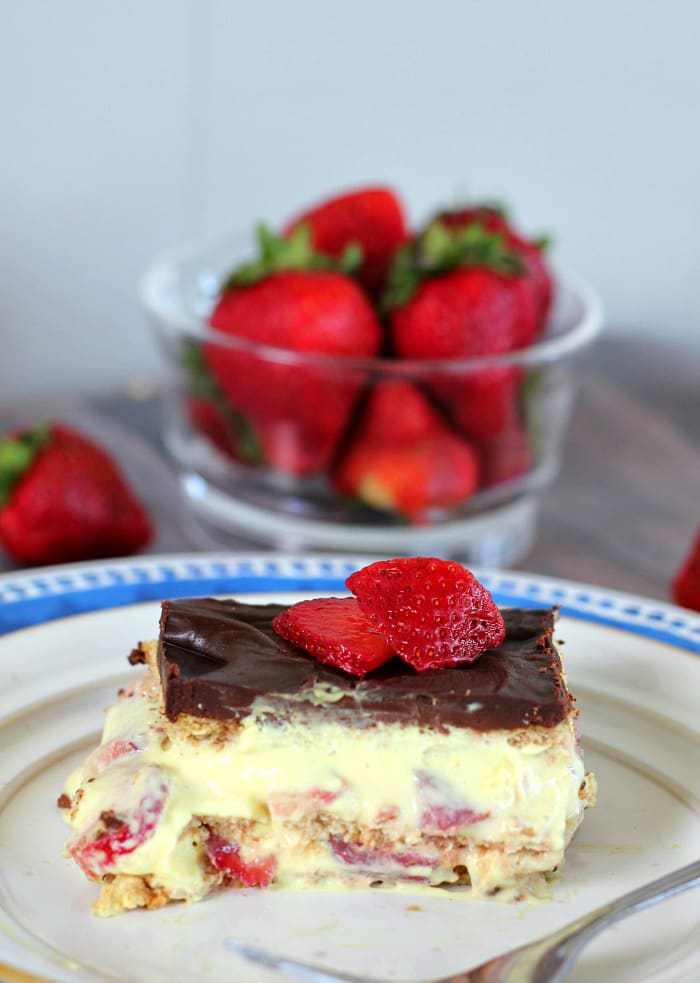 Banana Split Eclair Cake - The Baking ChocolaTess - August 2018 Recipe Round-Up - For the month of August, we're sharing all of our favorite summertime recipes to make for a backyard barbecue, picnic, or cookout. After all, the warm summer weather won't stick around forever, so we need to spend as much time outdoors as possible before autumn arrives.