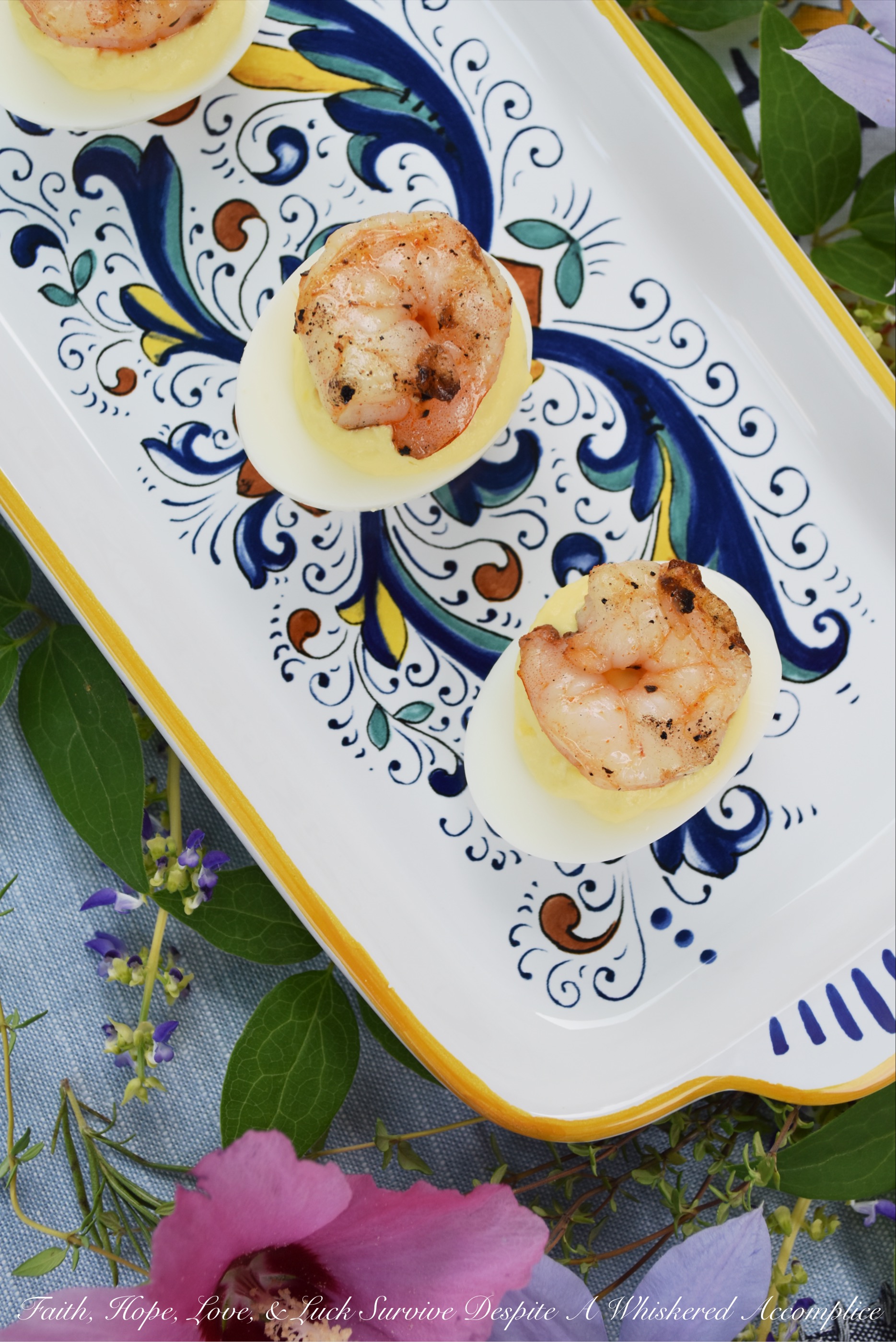 Creamy Horseradish Grilled Shrimp Deviled Eggs - Add a little zing to your next batch of deviled eggs by adding a little bit of creamy horseradish to the deviled egg filling. As an extra special treat, top each deviled egg with a shrimp which has been marinated in olive oil, salt, pepper, and paprika, and then grilled to perfection.