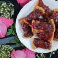 Bacon-Wrapped Cranberry Jalapeño Crackers - These may just be THE BEST APPETIZER you will ever eat. Buttery crackers are first wrapped in bacon before being topped with a sweet and spicy cranberry jalapeño jam sauce. To make these crackers even spicier, you can either top them with finely diced or thinly sliced additional jalapeño. Make a batch of the jam sauce ahead of time and freeze it in small batches, so that you'll always have some ready when you're in the mood to make this tasty treat.