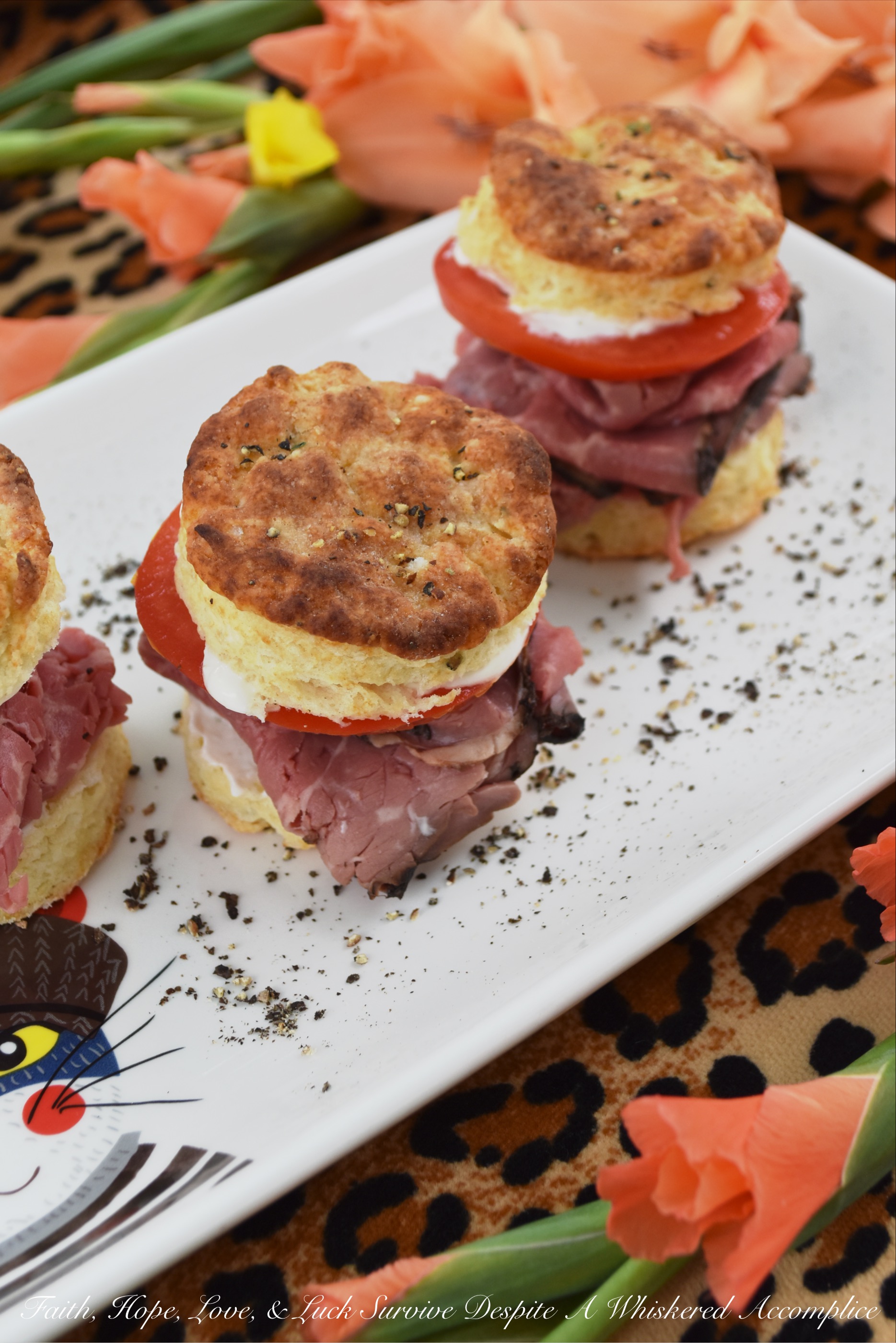 Salt & Pepper Horseradish Roast Beef Biscuits - What could be better than a roast beef sandwich? A roast beef sandwich on top of a warm homemade salt and pepper biscuit, slathered in a creamy horseradish sour cream sauce, which is then topped off with a juicy slice of ruby red tomato. Now that could possibly be the best roast beef sandwich ever.