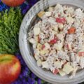 Pink Peppercorn & Curry Leaf Chicken Salad - Pink peppercorns and dried curry leaves bring a unique and subtle flavor to this pink peppercorn and curry leaf autumn chicken salad. To start with, the chicken is poached in seasoned water inside of a crockpot or slow cooker, to ensure that it is moist and extra flavorful. Then, it is gently tossed into a mayonnaise and apple cider vinegar mixture along with crunchy fall apples and additional pink peppercorns.