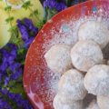 Powdered Sugar Lemon Tea Cookies - These delicate lemon cookies are the perfect cookie to serve alongside a hot cup of tea. Before baking, they're rolled in powdered sugar for an extra sweet flavor, and after baking, they're lightly dusted with powdered sugar to help make them look just as fabulous as they taste.