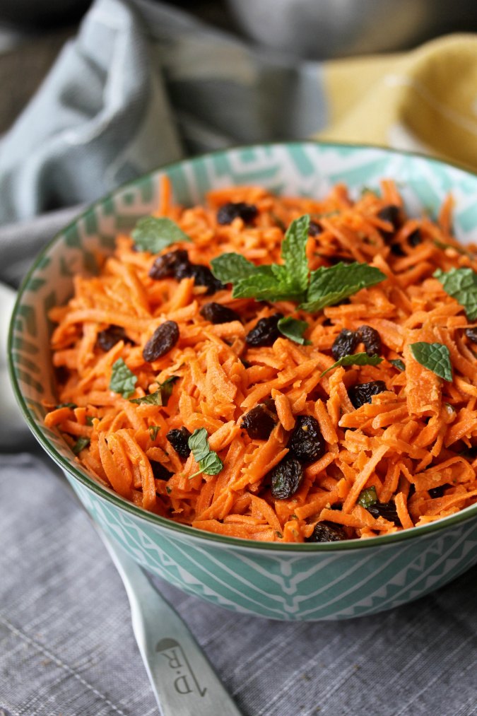 Carrot and Raisin Slaw with Cumin Yogurt Dressing - Karen's Kitchen Stories - Welcome to the Friday Frenzy, the best food and craft link party on the web. Visit us this week to see what recipes and crafts we are most excited about.