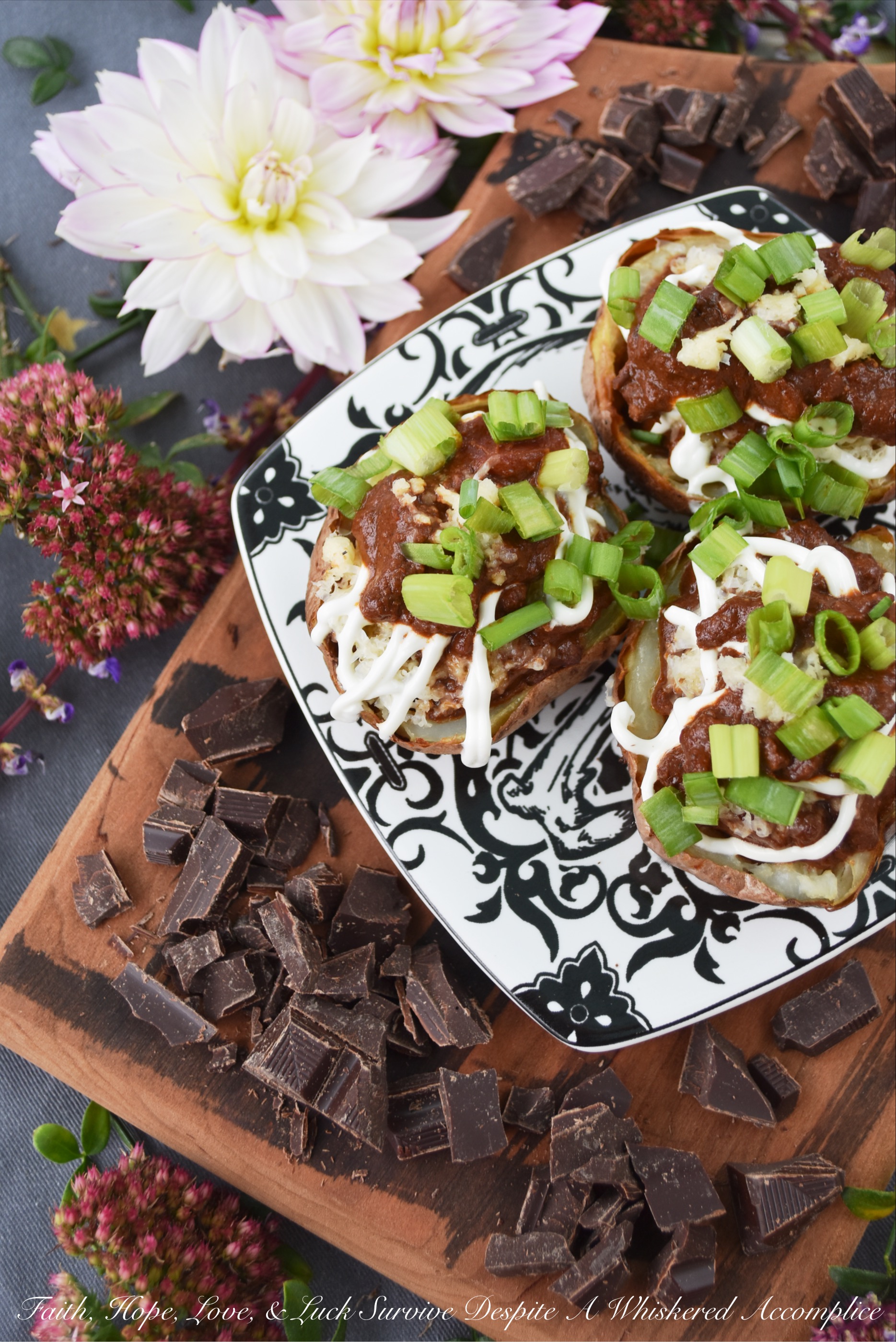 Secret Ingredient Beef Nacho Potato Skins - There's a secret ingredient used in these potato skins which helps make them taste absolutely amazing. Can you guess what it is? Chocolate. Adding a little bit of bittersweet baking chocolate to the nacho beef mixture stuffed inside of these oven-baked potato skins truly does make all the difference. Don't believe me? Give them a try and see for yourself.